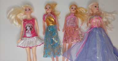 Лялька барбі  в сукні
