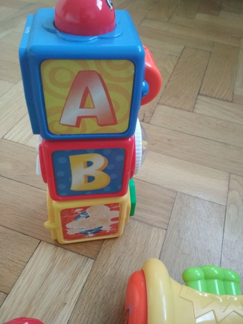 Zabawki Fisher Price pchacz krokodyl,grające pianinko, trąbka i klock