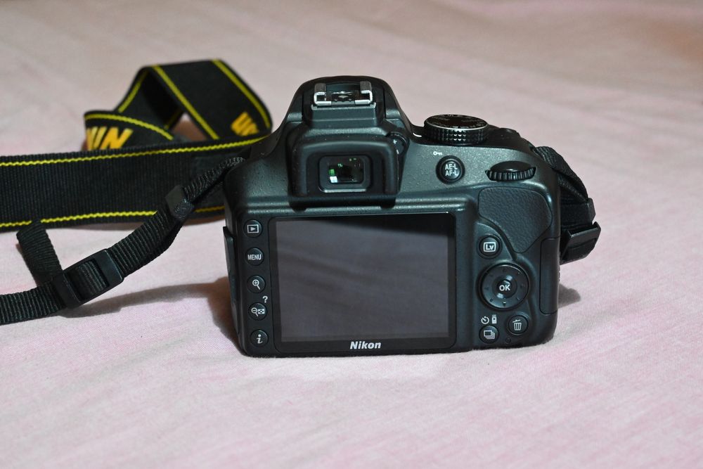 Nikon D3400, lentes 18-55, 35mm e 55-200,  tripé e bolsa