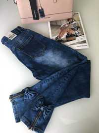 Sprzedam spodnie jeans roz 46 z kokardkami