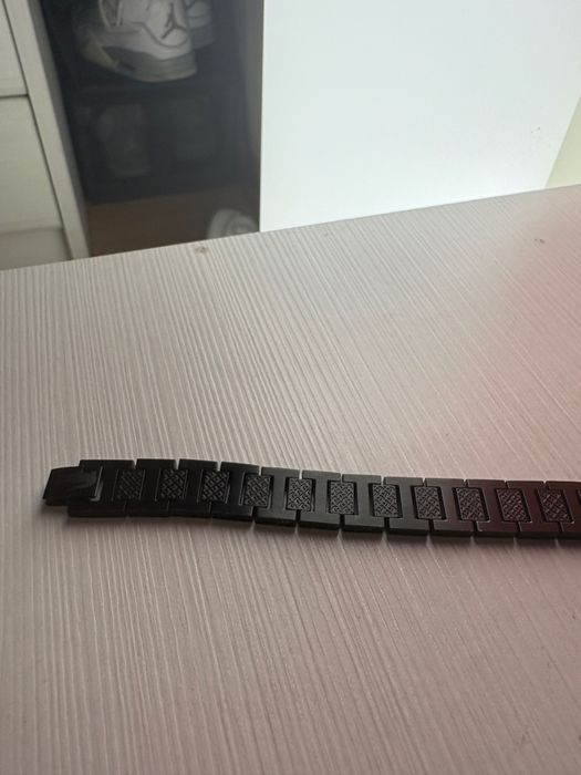 pulseira preta lacoste