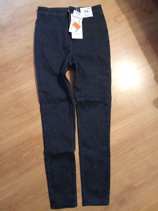 Spodnie błyszczące Sinsay 38