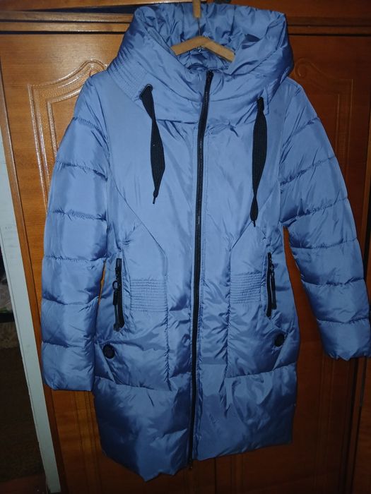 Новый  пуховик отличном состоянии и  качества