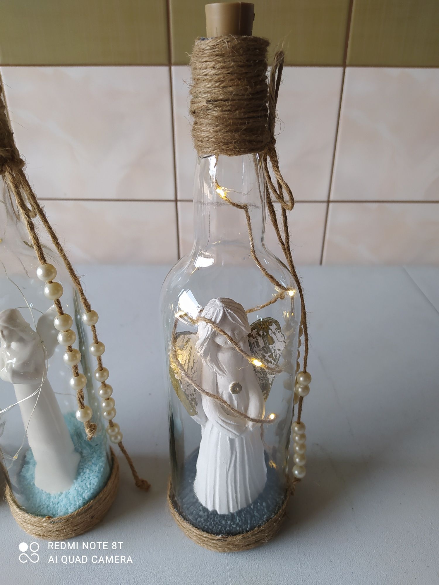 Aniołki  ceramiczne zamknięte w butelce