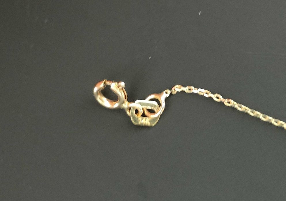 Naszyjnik złoty pióro z cyrkoniami