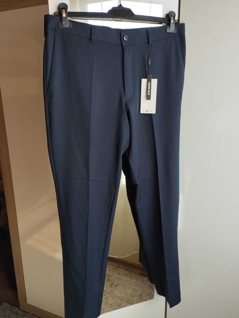 Granatowe męskie spodnie eleganckie garniturowe nowe 54 Jack Jones