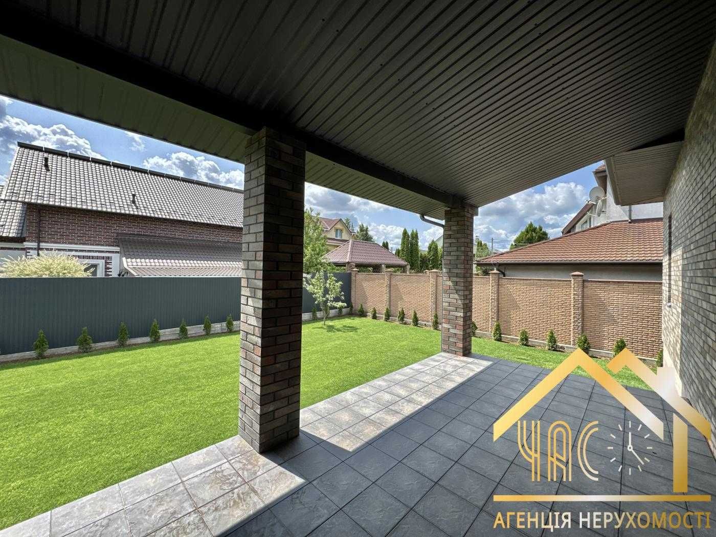 Продаж будинку 228м² з цокольним поверхом, гаражем, навісом та терасою