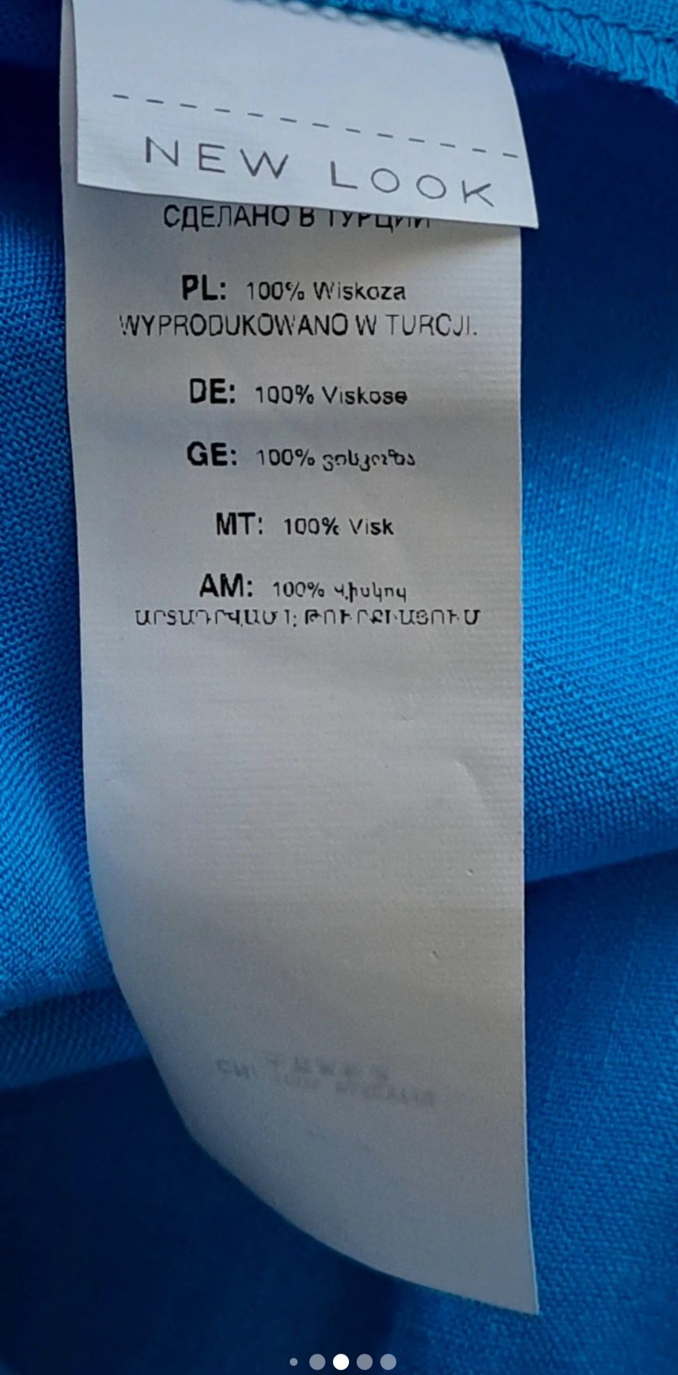 Dluga sukienka na ramiączkach z falbankami na krzyżak z tylu