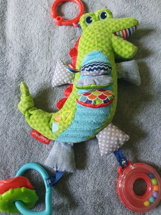 Zabawka sensoryczna zawieszka do wózka smok Fisher Price z grzechotką