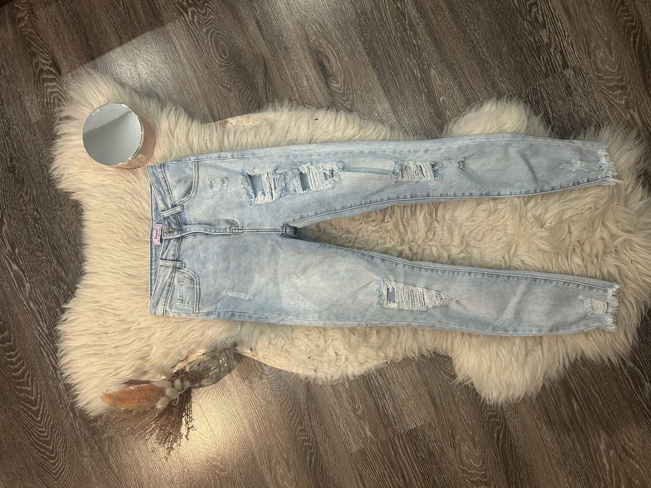 Jasnoniebieskie skinny jeans obcisłe spodnie jeansy z dziurami