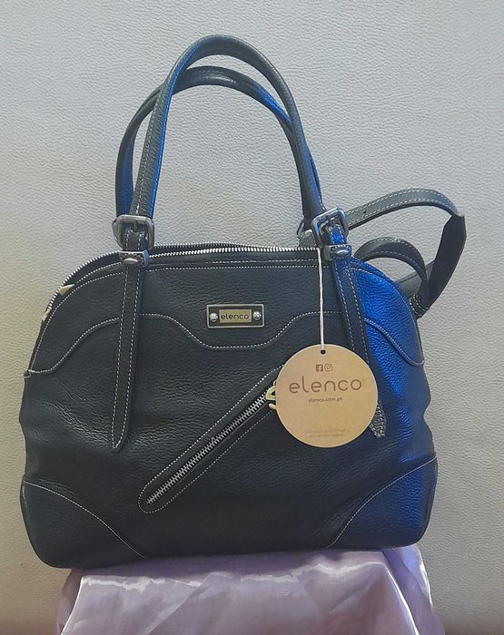 Mala em pele nova com etiqueta de marca Elenco