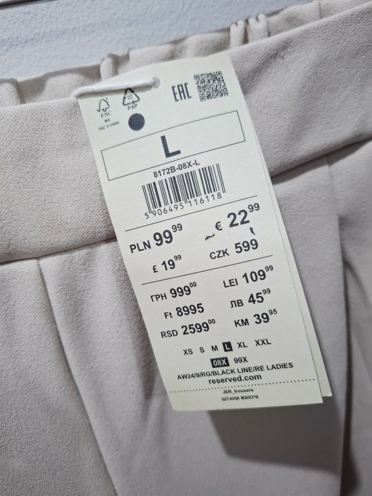 Nowe beżowe spodnie casual reserved l 40