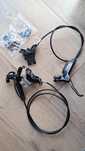 Hamulce hydrauliczne SRAM Guide T czterotloczkowe z adapterami do MTB