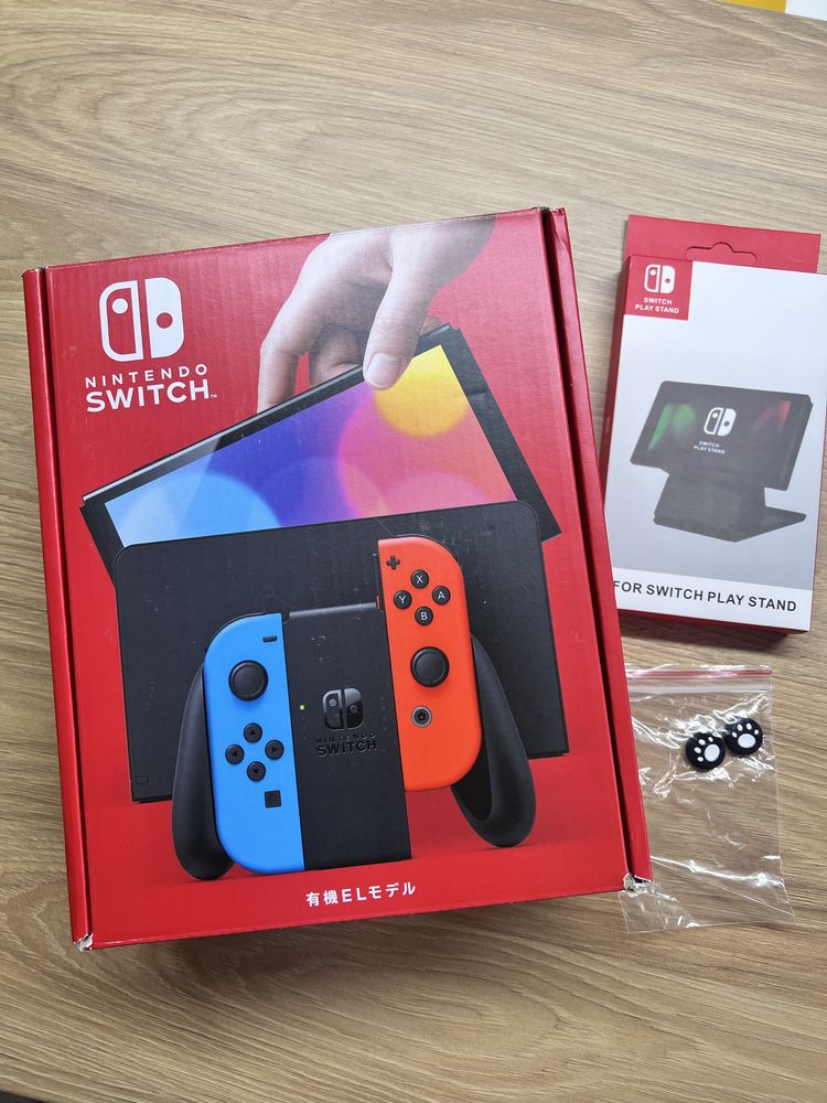 Nintendo Switch OLED (нова)  +фірмова підставка +накладки на стіки