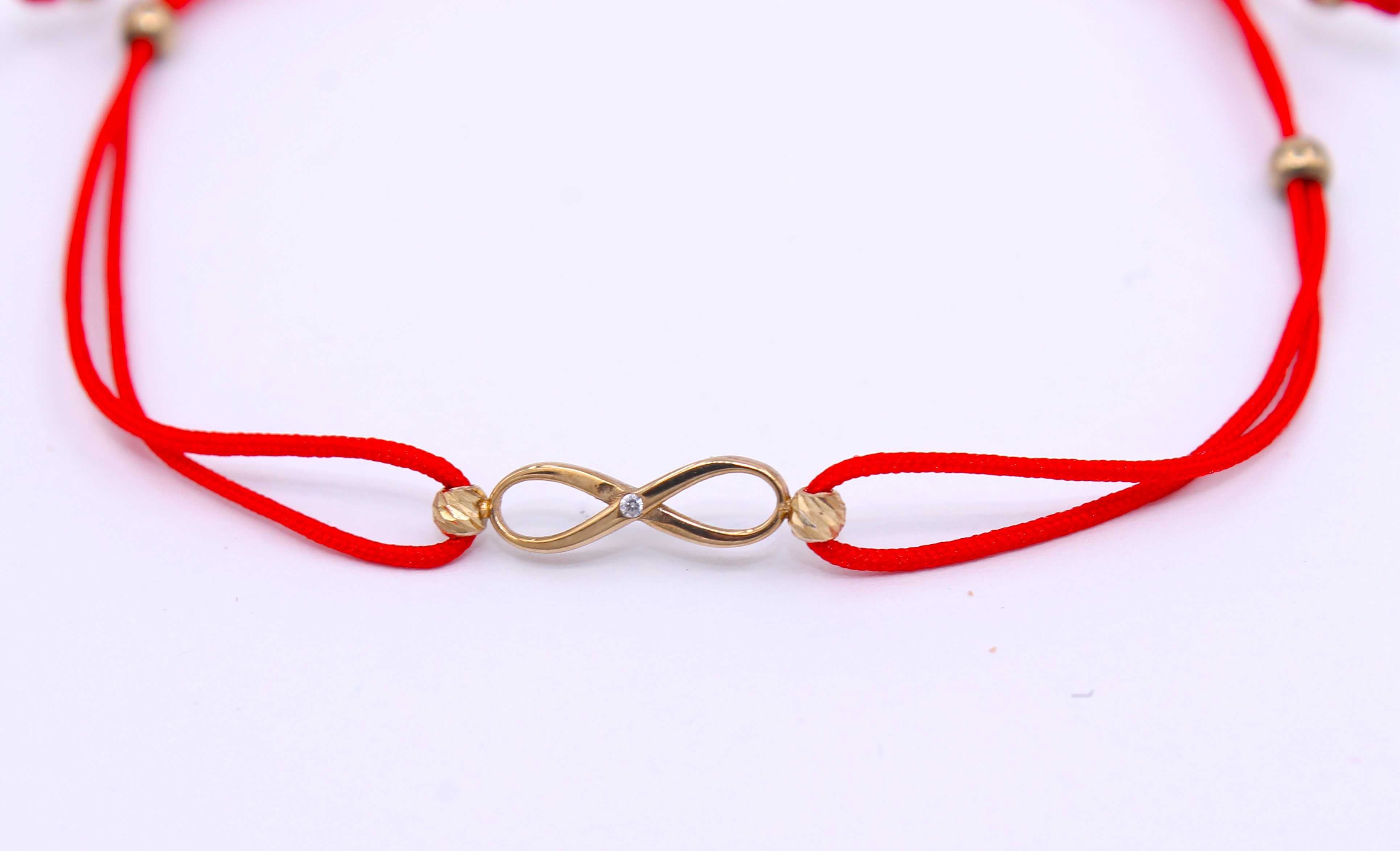 Czerwona, sznurkowa bransoletka ze złotymi elementami p.333/0,87g