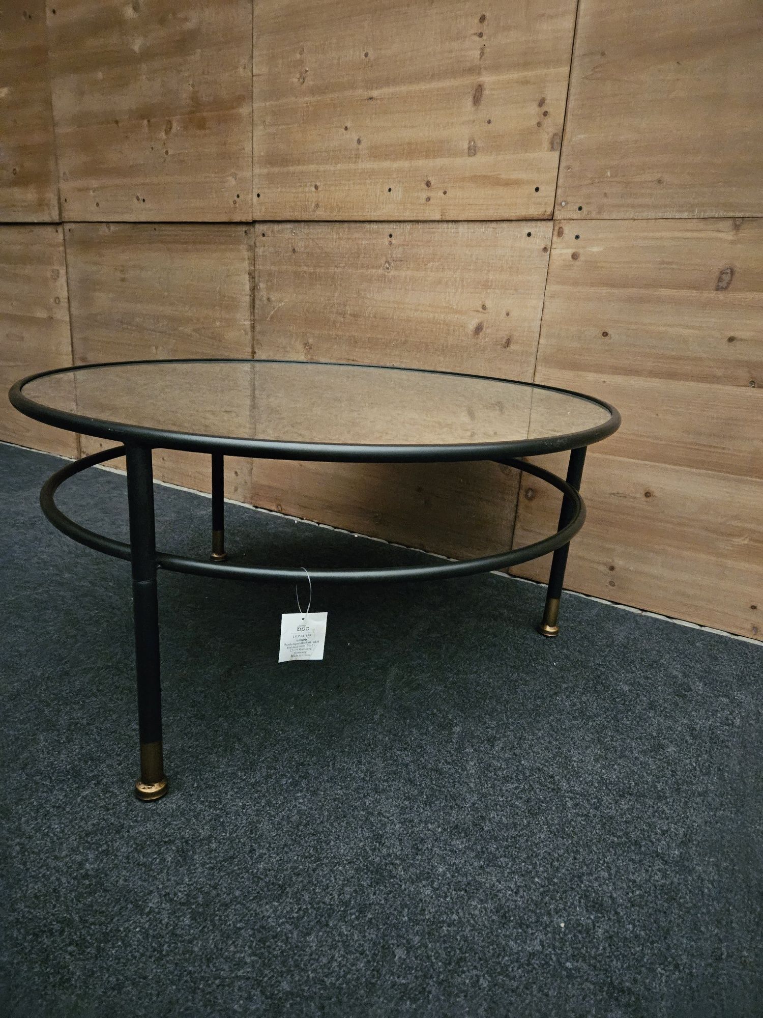 Czarny metalowy okrągły stolik lustrzany blat