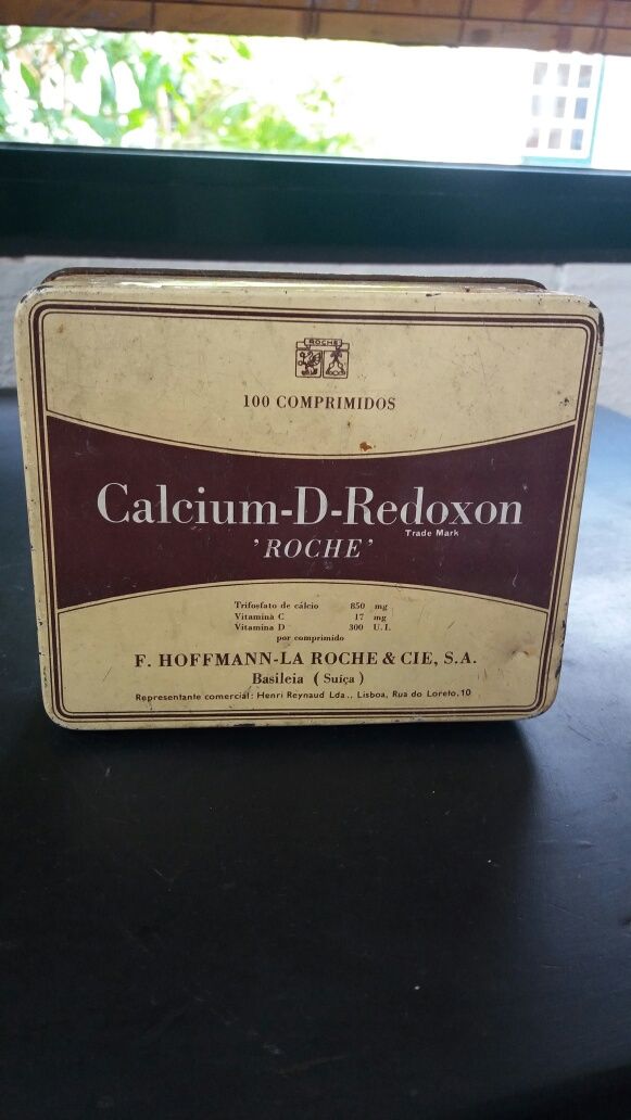 Caixa-.C. D-Redoxon -Roche.  E medida azeite c. Inscrição.
