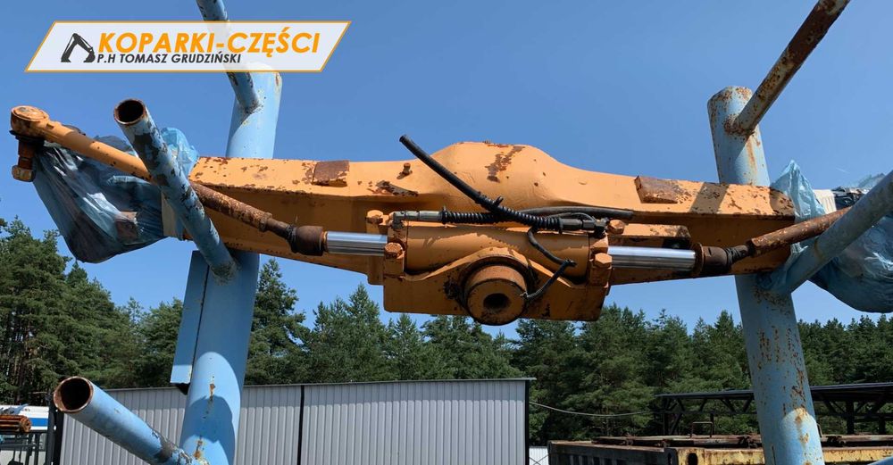 Belka mostu przedniego z siłownikiem skrętu New Holland, Case, Hitachi