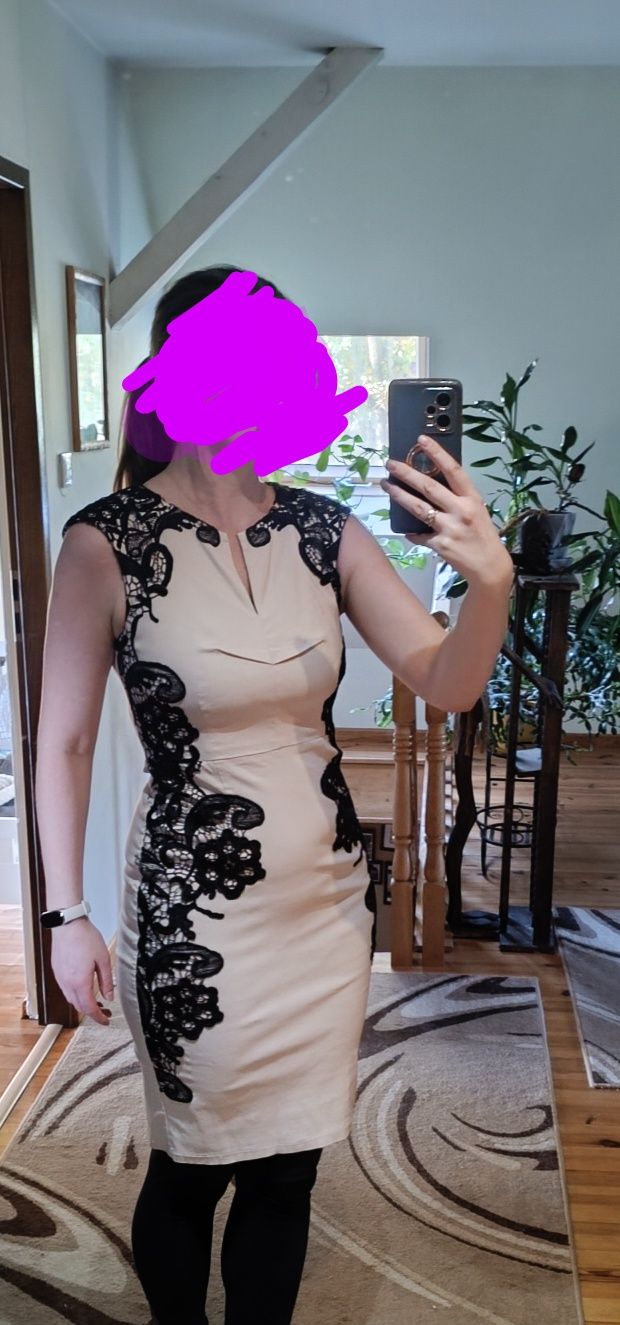 Elegancka dopasowana sukienka 38