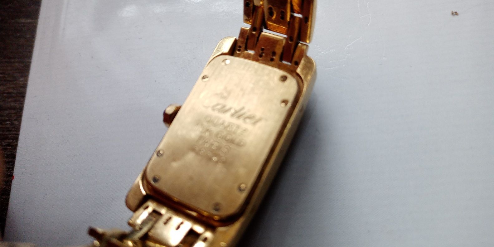 Złoty zegarek, cartier z brylantami, pr.750