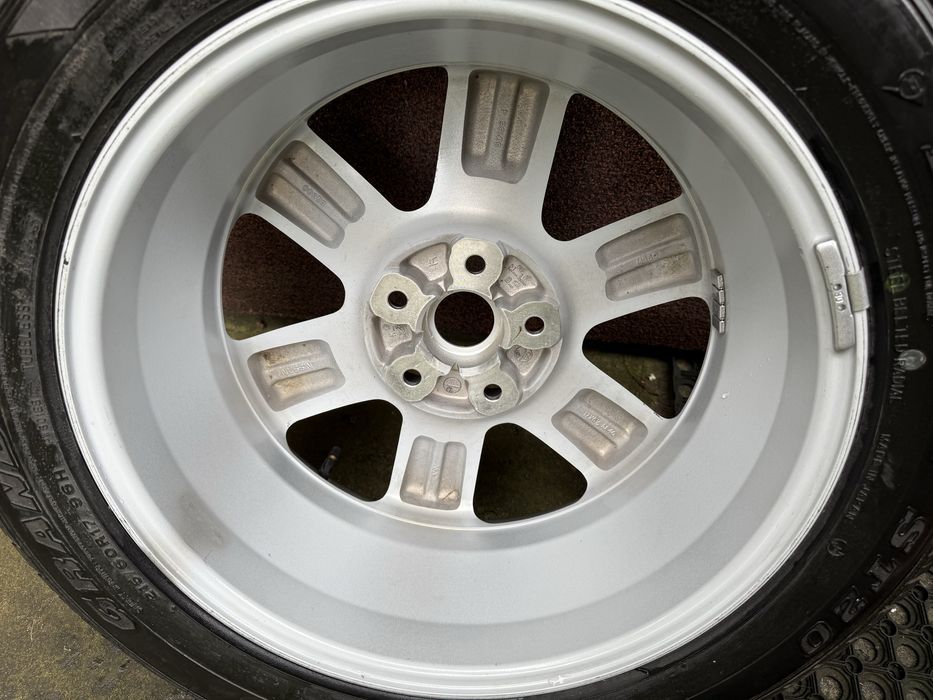 Felga aluminiowa oryginalna z nową oponą do Nissana X-Trail T30
