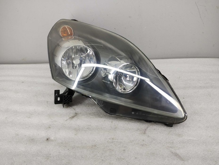Lampa reflektor Opel Zafira B Prawa