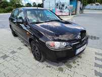 Nissan Almera.   2003r