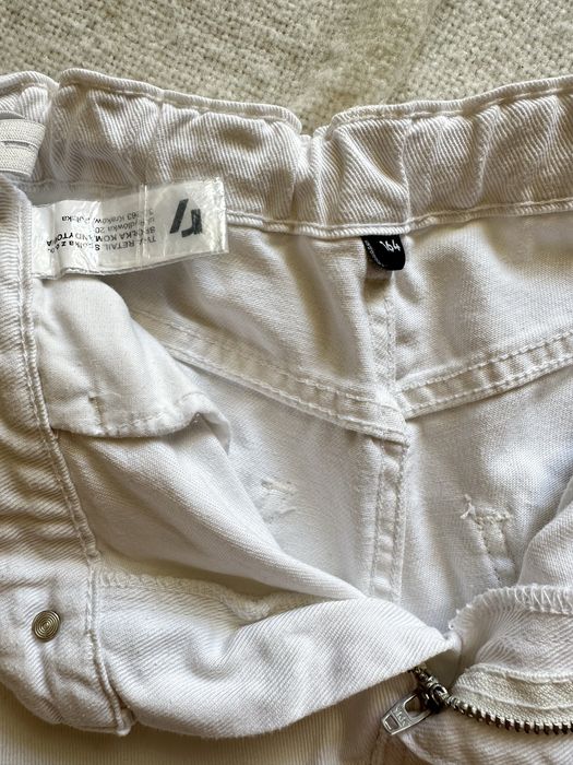 Білі джинси з кишенями 164см