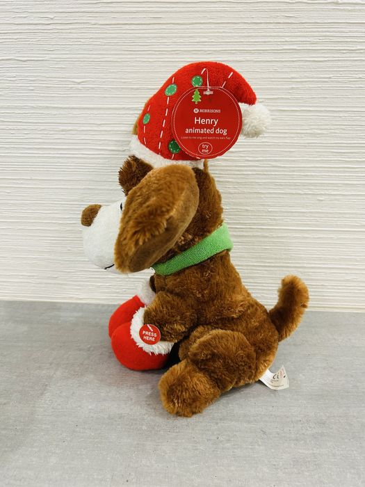 Інтерактивна різдвяна собачка. Співає пісні та шевелить вухами.