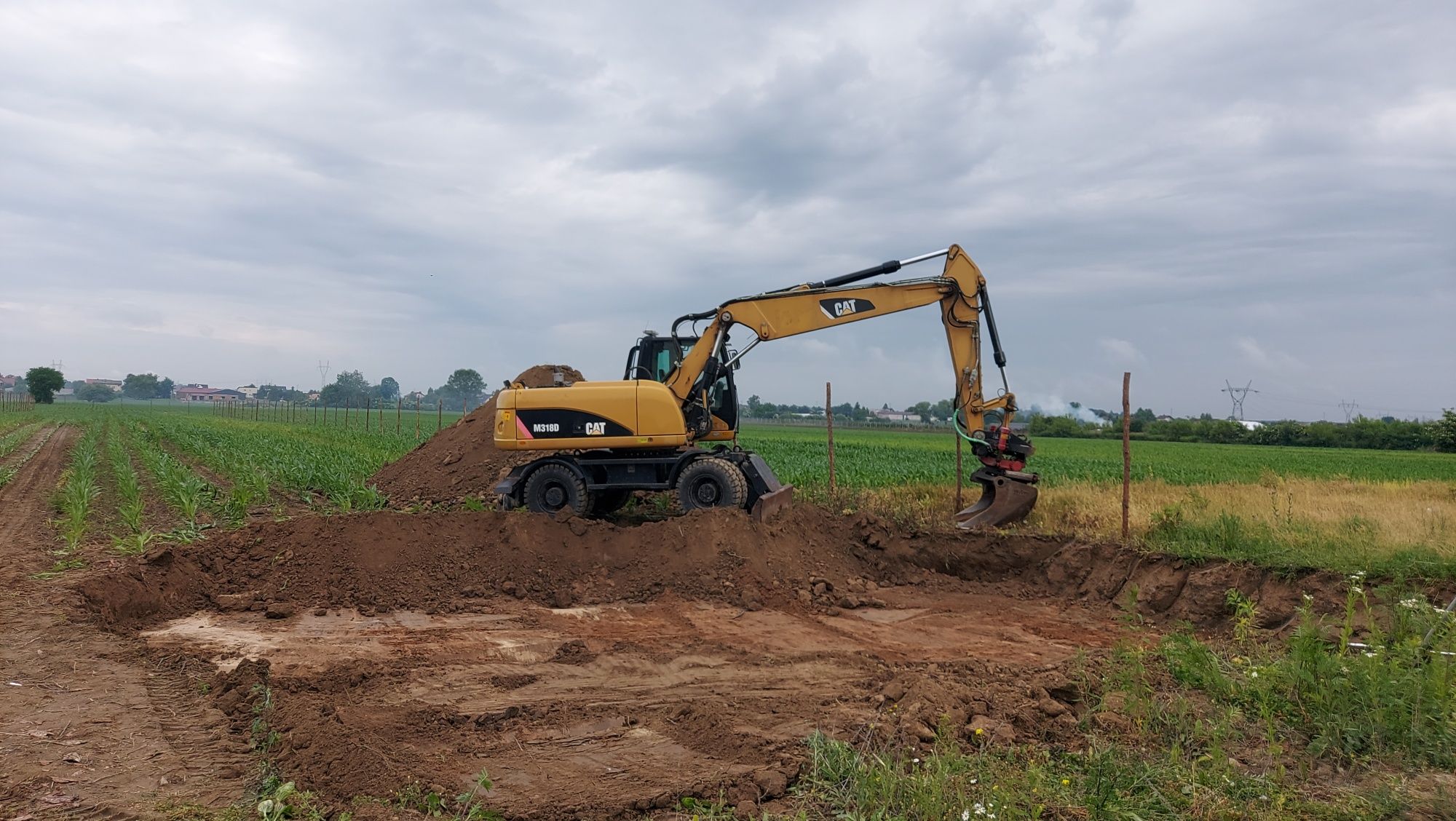 Wynajem koparki kołowej cat m318d 18ton 20ton  z rototilt bez operator