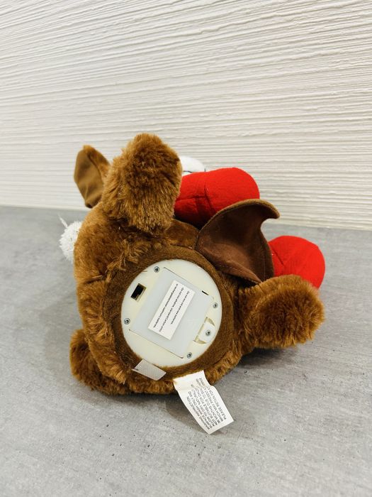 Інтерактивна різдвяна собачка. Співає пісні та шевелить вухами.