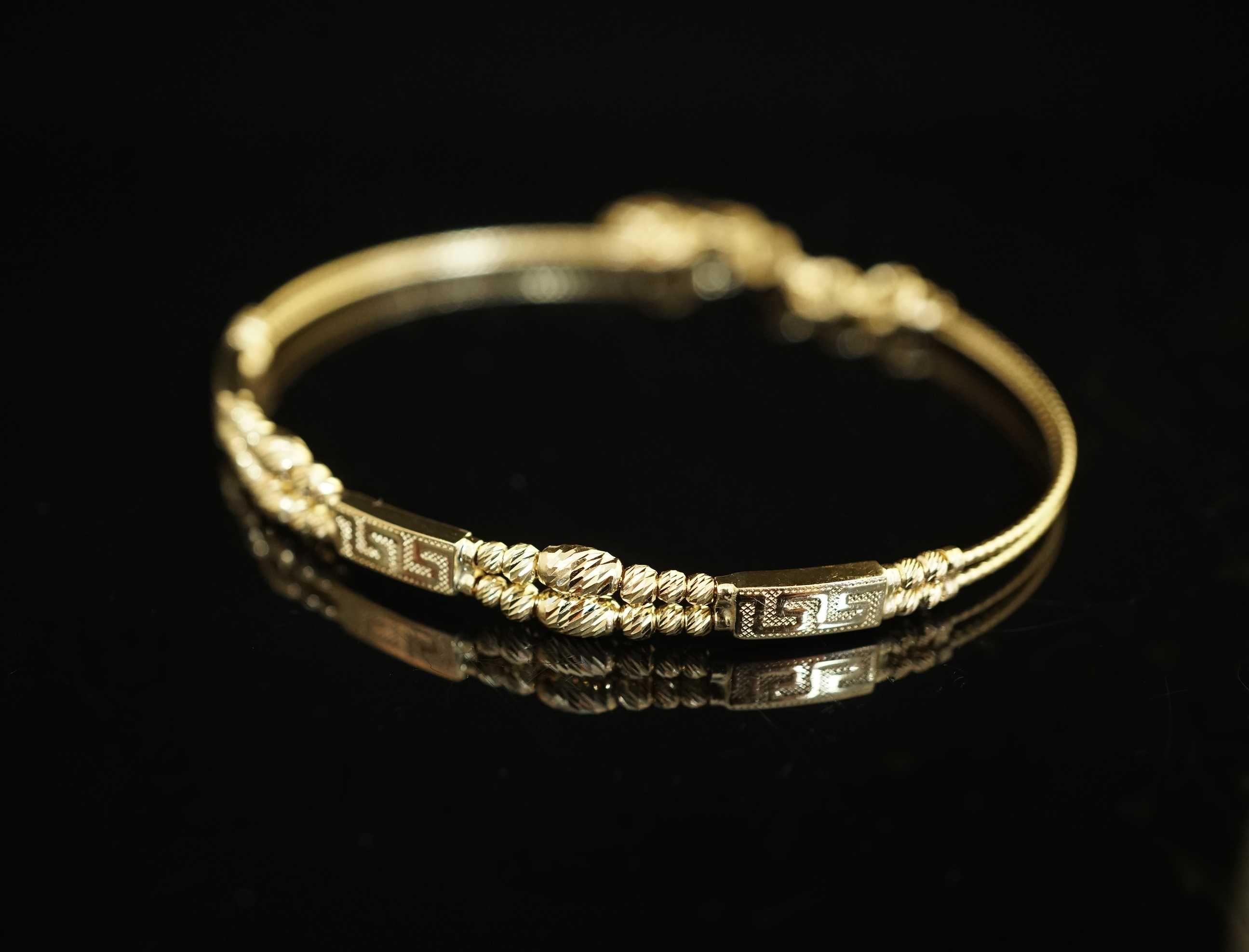Złoto- 585 złota damska bransoletka bangle sztywna  grecki wzór