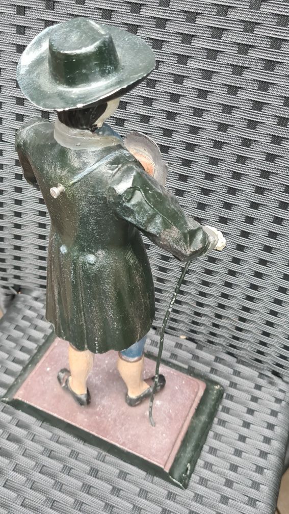 Zegar figuralny, figura sprzedawca zegarów