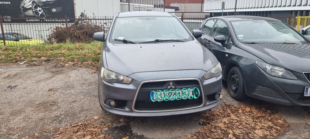 Mitsubishi Lancer Kolor A39, zderzak maska lampa błotnik drzwi