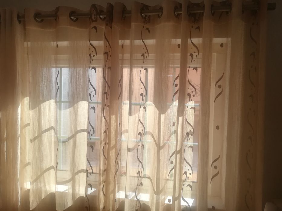 Conjunto de cortinados com argolas