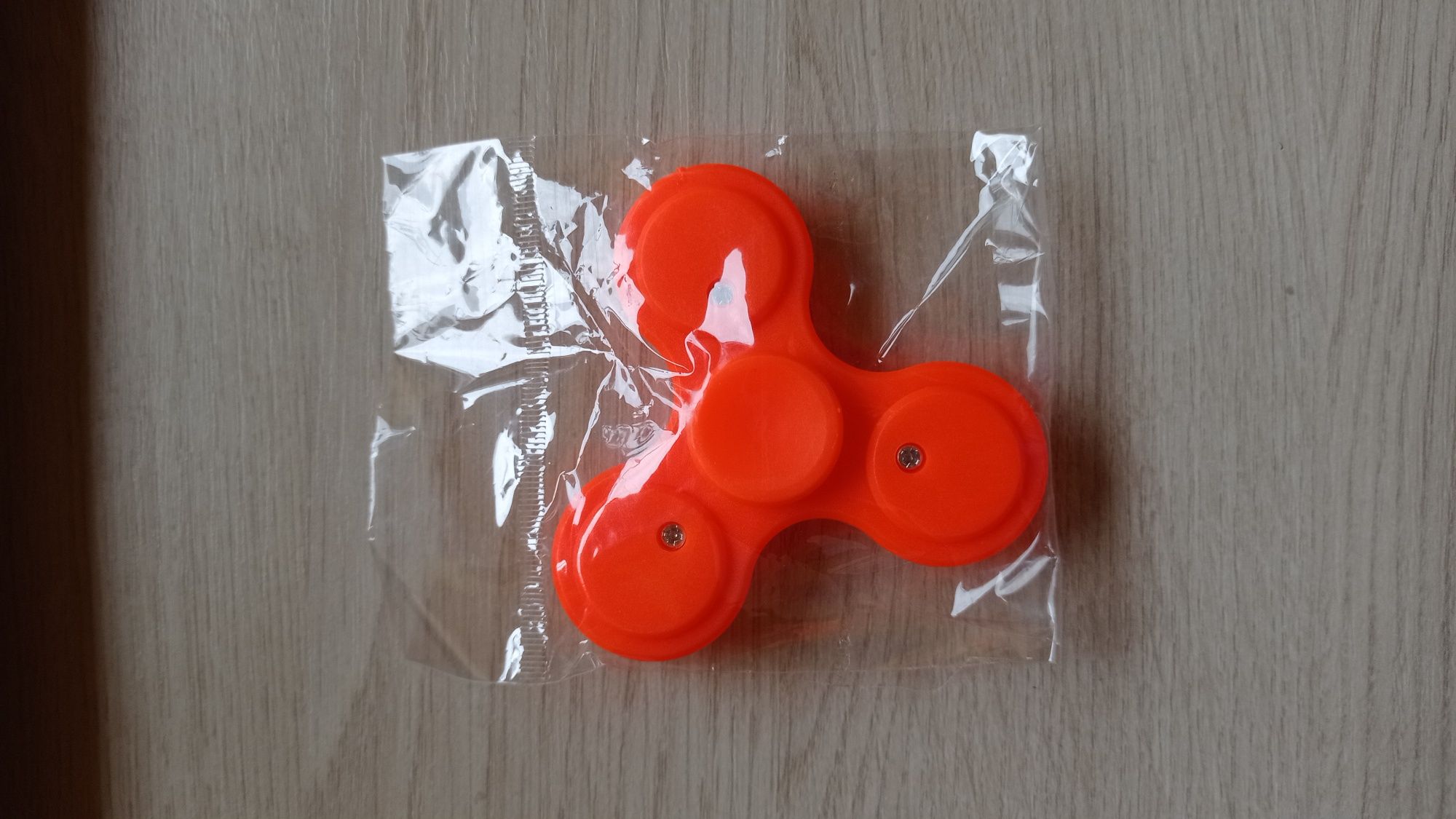 Fidget spinner spiner - nowy w folii, nieużywany - kol.jaskrawy orange
