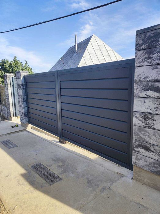 ... SaneX - Group ... Фабрика воріт та металоконструкцій