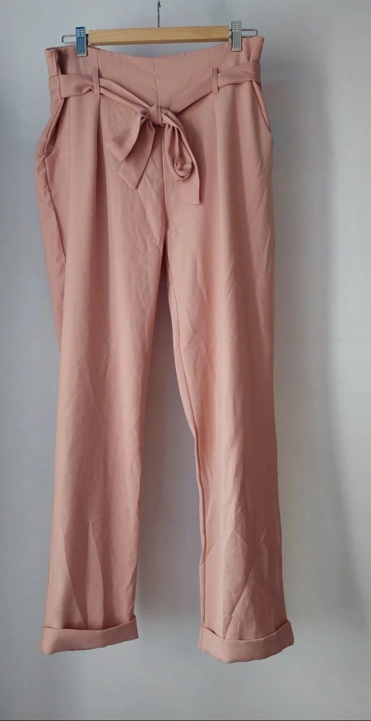 Różowe spodnie Reserved roz 42