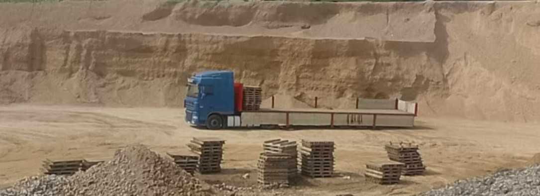 Usługi Koparko ładowarką CAT 428C oraz transport od 20t.