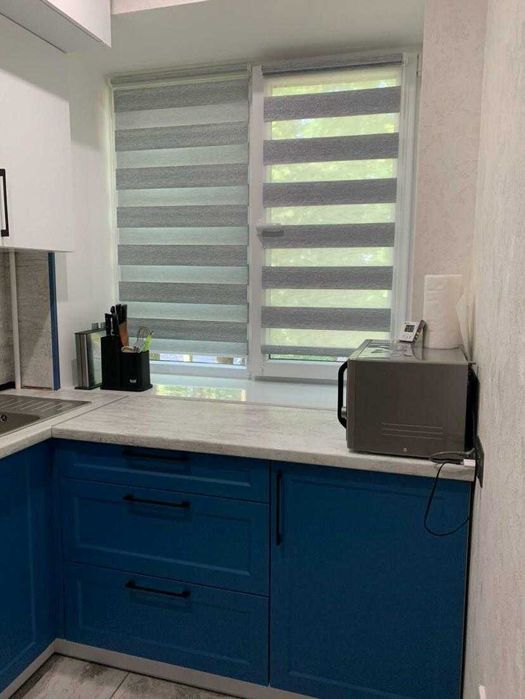 Жовтневе, виробник рулонних штор, тканинних «День-Ніч» жалюзей.