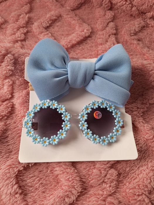 Nowe niebieskie dziecięce okulary przeciwsłoneczne dla dziecka dziewcz