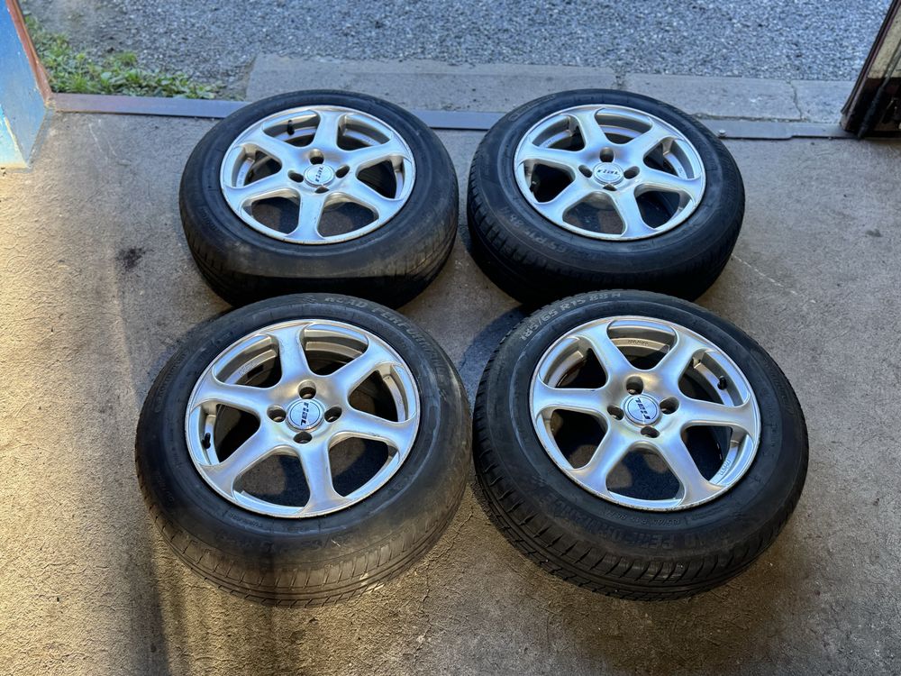 Koła felgi aluminiowe RIAL 4x100 R15 185/65 R15 letnie opony 2024 rok
