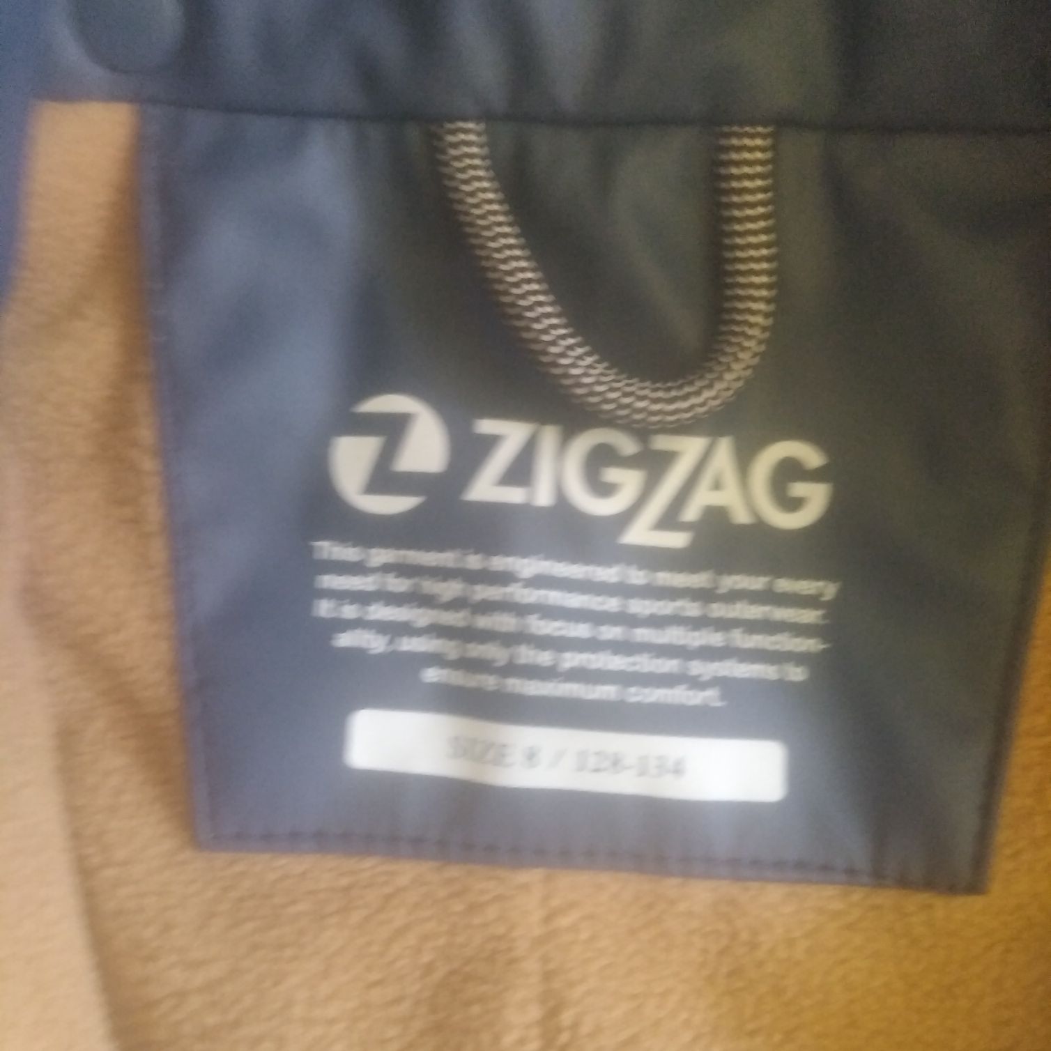 Kombinezon przeciwdeszczowy ocieplany na 128/134 cm Zig Zag