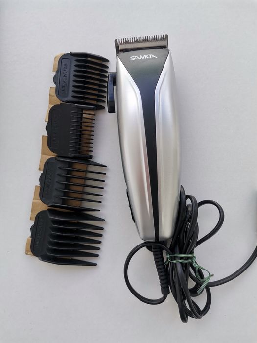 Máquina corte cabelo eléctrica.