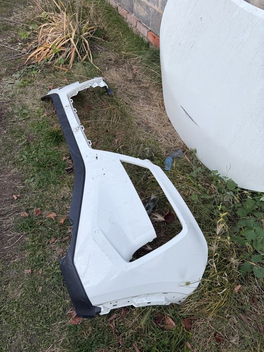 Передний бампер Nissan Rogue T33 дорест левая часть