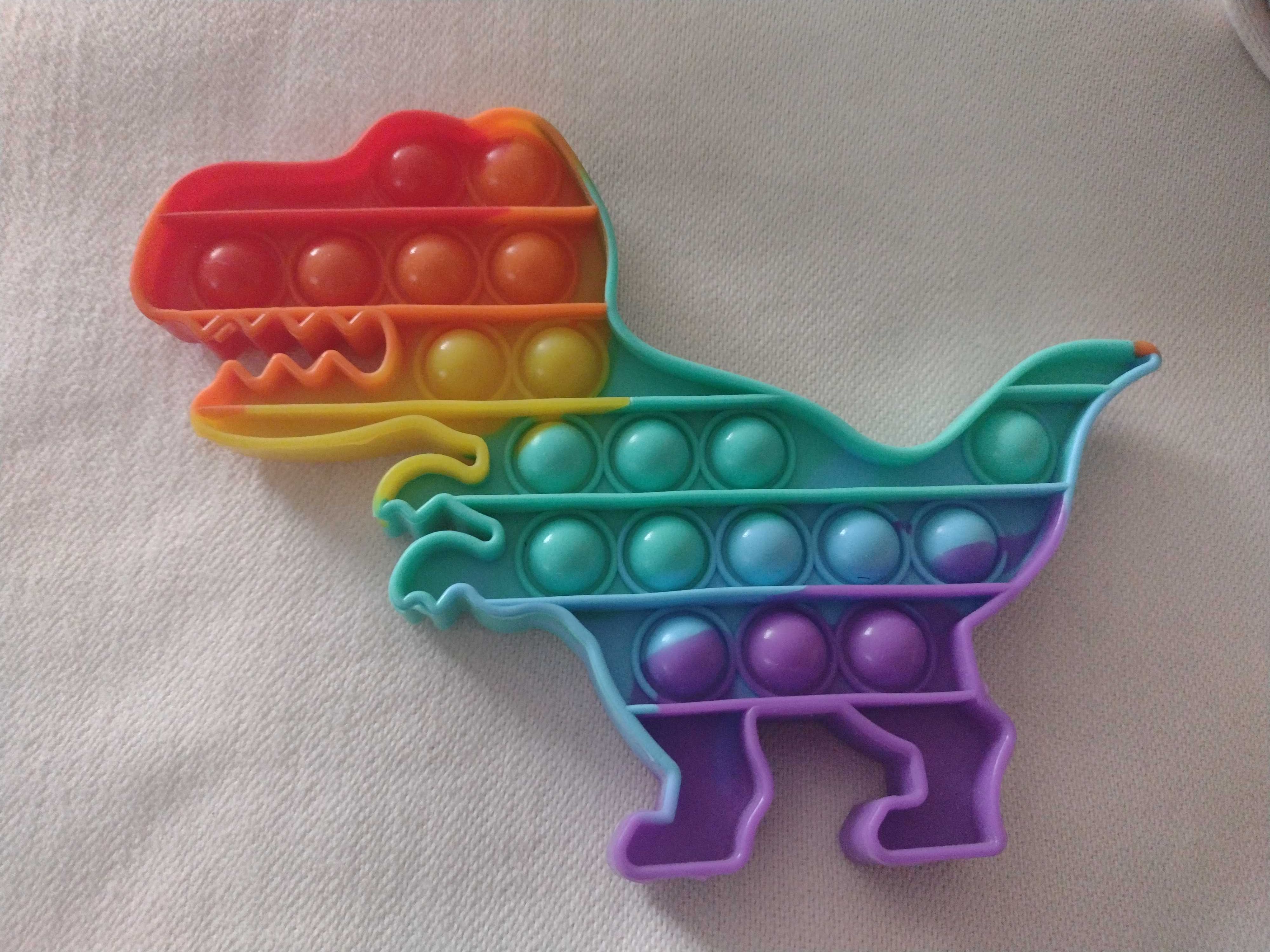 zabawka SENSORYCZNA PUSH BUBBLE POP IT. Dinozaur. Stan idealny