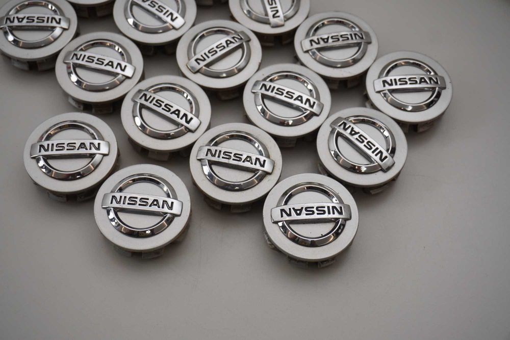 Dekielki oryginał Nissan OE 54mm 40342 AV610 srebrne 4sztuki