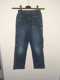 Spodnie jeansowe r.134 Kora
