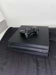 PS 4 Pro + 2 gry