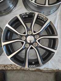 323 Felgi aluminiowe ORYGINAŁ MITSUBISHI R 16 5x114,3 otwór 67 B. Ładn